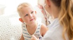 curious little boy looking at female doctor 1 
